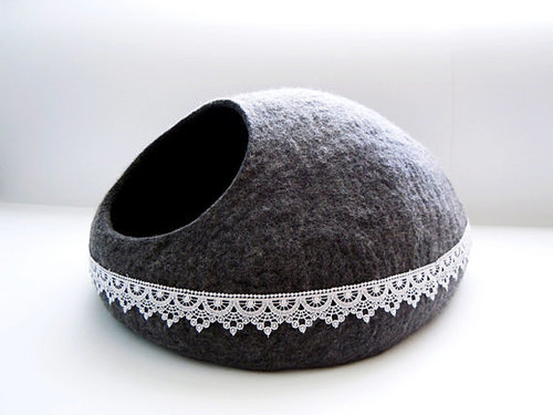 The lace detailing on this grey felted cat bed (from $64) takes it to the next level.
The lace detailing on this grey felted cat bed (from $64) takes it to the next level.