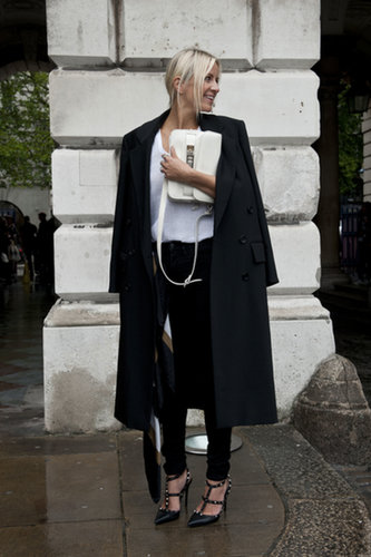White and black, with only the best accessories, like her Proenza bag and Valentino heels.
White and black, with only the best accessories, like her Proenza bag and Valentino heels.