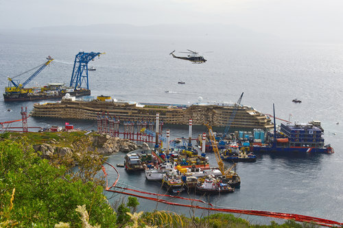 The upright ship was prepared to be towed away and scrapped.
The upright ship was prepared to be towed away and scrapped.