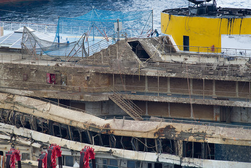Severe damage could be seen along the ship after it was pulled upright.
Severe damage could be seen along the ship after it was pulled upright.