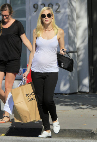 The expectant mother paired a casual white tank with black skinny jeans, white loafers, and oversized round sunglasses during a shopping trip in Beverly Hills.
The expectant mother paired a casual white tank with black skinny jeans, white loafers, and oversized round sunglasses during a shopping trip in Beverly Hills.