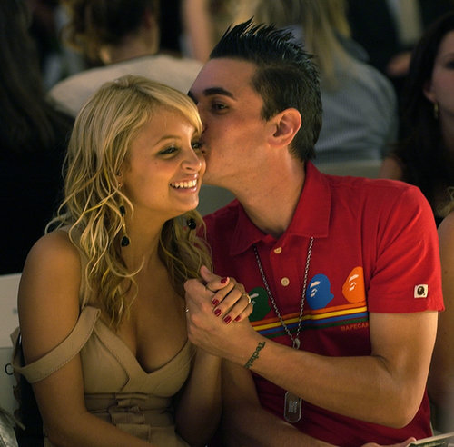 Nicole Richie was given a sweet smooch by her then-boyfriend, the late DJ AM, as they sat front row for the Monique Lhuillier runway show in September 2004.
Nicole Richie was given a sweet smooch by her then-boyfriend, the late DJ AM, as they sat front row for the Monique Lhuillier runway show in September 2004.