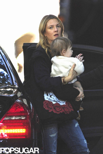 Drew Barrymore carried little Olive during a birthday visit with Jimmy Fallon.
Drew Barrymore carried little Olive during a birthday visit with Jimmy Fallon.