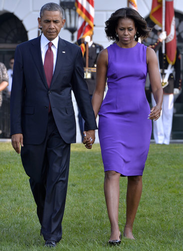 President Obama and the first lady, clad in a royal-purple shift, walked hand in hand during the 9/11 anniversary memorial in Washington. That dress needed little else but small drop earrings and black patent pumps.
President Obama and the first lady, clad in a royal-purple shift, walked hand in hand during the 9/11 anniversary memorial in Washington. That dress needed little else but small drop earrings and black patent pumps.
