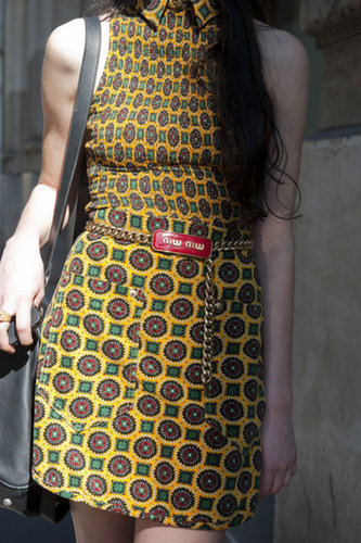 Channeling the '70s with a retro print and a chain-link Miu Miu belt.
Channeling the '70s with a retro print and a chain-link Miu Miu belt.