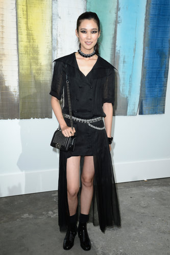Tao Okamoto bared her gams in an asymmetric black design at Chanel.
Tao Okamoto bared her gams in an asymmetric black design at Chanel.