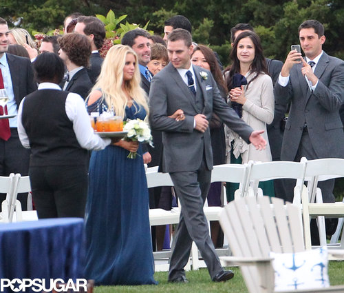 Jessica Simpson walked down the aisle with a groomsman.
Jessica Simpson walked down the aisle with a groomsman.