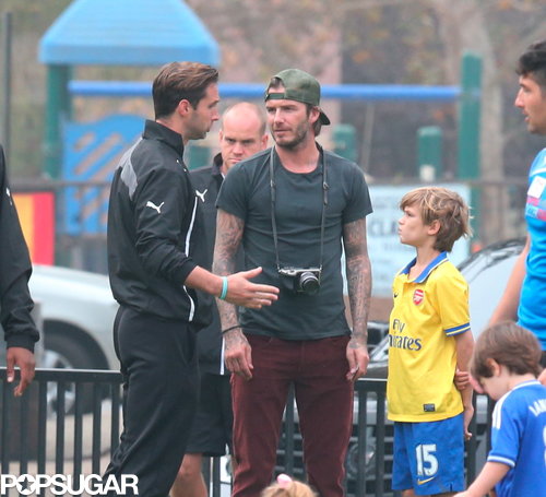 David Beckham snapped pictures of his little girl while she played soccer.
David Beckham snapped pictures of his little girl while she played soccer.