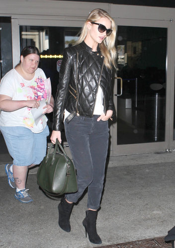 Rosie Huntington-Whiteley amped up her dark ensemble with a black quilted leather jacket while arriving at LAX airport.
Rosie Huntington-Whiteley amped up her dark ensemble with a black quilted leather jacket while arriving at LAX airport.
