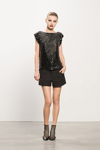 Boatneck Black Beaded Top ($495), Pique Black Shorts ($375), Secret Place Black Open Back Booties ($895)
Photo courtesy of Tamara Mellon
Boatneck Black Beaded Top ($495), Pique Black Shorts ($375), Secret Place Black Open Back Booties ($895)
Photo courtesy of Tamara Mellon