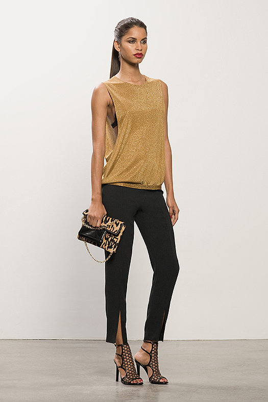 Lurex Gold Tank ($450), Cashmere Black Bra ($125), Crepe Black Cigarette Pant ($550), Submission Black Studded Sandal ($995), TM Feel Leopard Pony Bag ($895)
Photo courtesy of Tamara Mellon
Lurex Gold Tank ($450), Cashmere Black Bra ($125), Crepe Black Cigarette Pant ($550), Submission Black Studded Sandal ($995), TM Feel Leopard Pony Bag ($895)
Photo courtesy of Tamara Mellon
