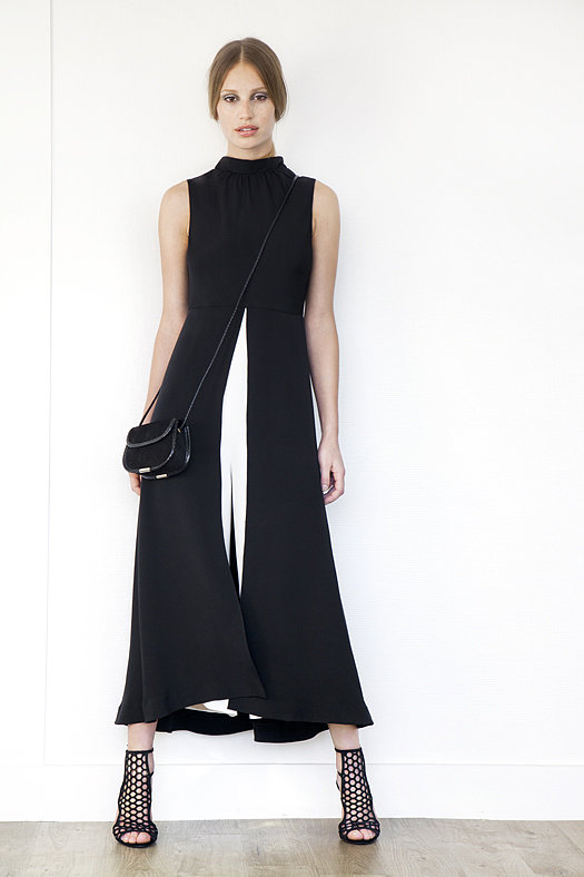 Jumpsuit Dress in Two-Toned Silk in Black & Cream ($1,295), Scandal Suede Sandal Bootie in Black ($895), Treasure Suede Cross Body Bag in Black ($650)
Photo courtesy of Tamara Mellon
Jumpsuit Dress in Two-Toned Silk in Black & Cream ($1,295), Scandal Suede Sandal Bootie in Black ($895), Treasure Suede Cross Body Bag in Black ($650)
Photo courtesy of Tamara Mellon