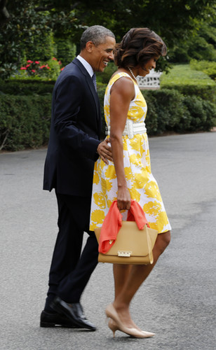 President Obama stuck close to Michelle during their Saturday travels.
President Obama stuck close to Michelle during their Saturday travels.