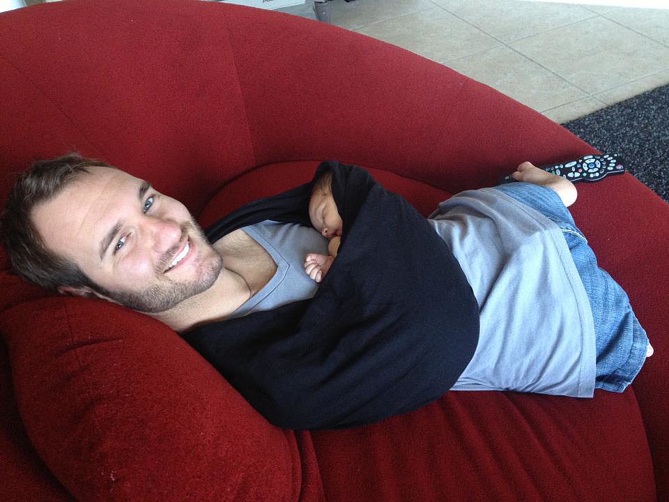 Motivational Speaker Nick Vujicic, Born Without Limbs, Holds His Child Motivational Speaker Nick Vujicic, Born Without Limbs, Holds His Child
