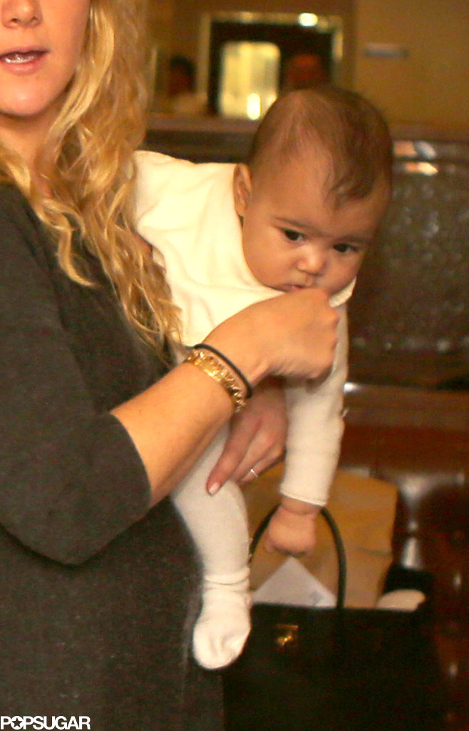 North West wore a white one piece. North West wore a white one piece.