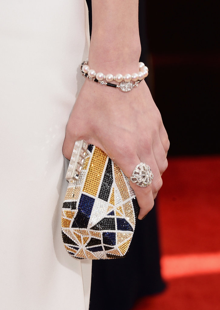 Laura Carmichael's multicolored minaudière and Chanel fine jewelry ring and bracelet were perfectly matched.
Laura Carmichael's multicolored minaudière and Chanel fine jewelry ring and bracelet were perfectly matched.
