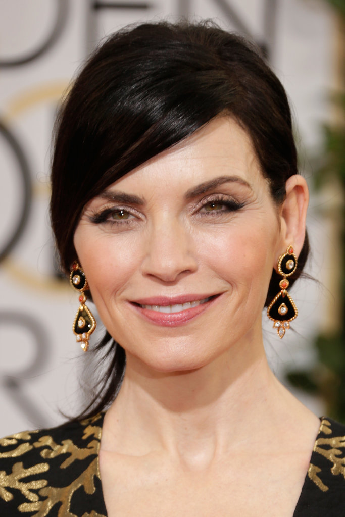 Julianna Margulies echoed the black and gold of her gown with Van Cleef & Arpels "1973" earrings.
Julianna Margulies echoed the black and gold of her gown with Van Cleef & Arpels "1973" earrings.
