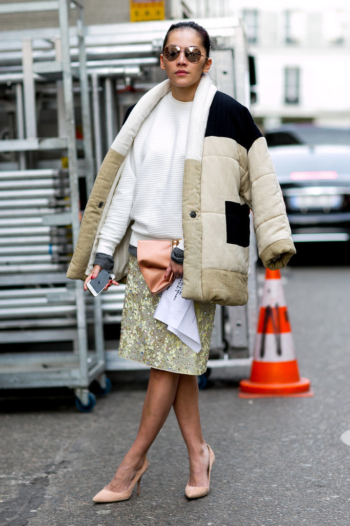 Don't reserve your puffy jackets for sportswear only; just look how well it pairs with a pretty skirt. 
