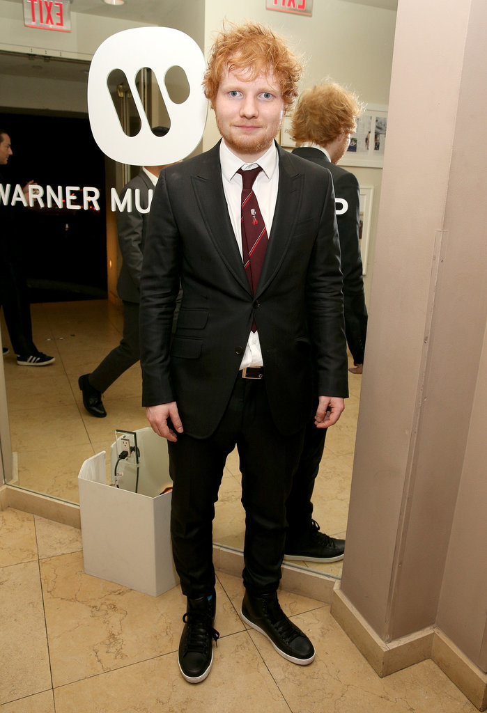 Ed Sheeran suited up for the Warner Music afterparty.
