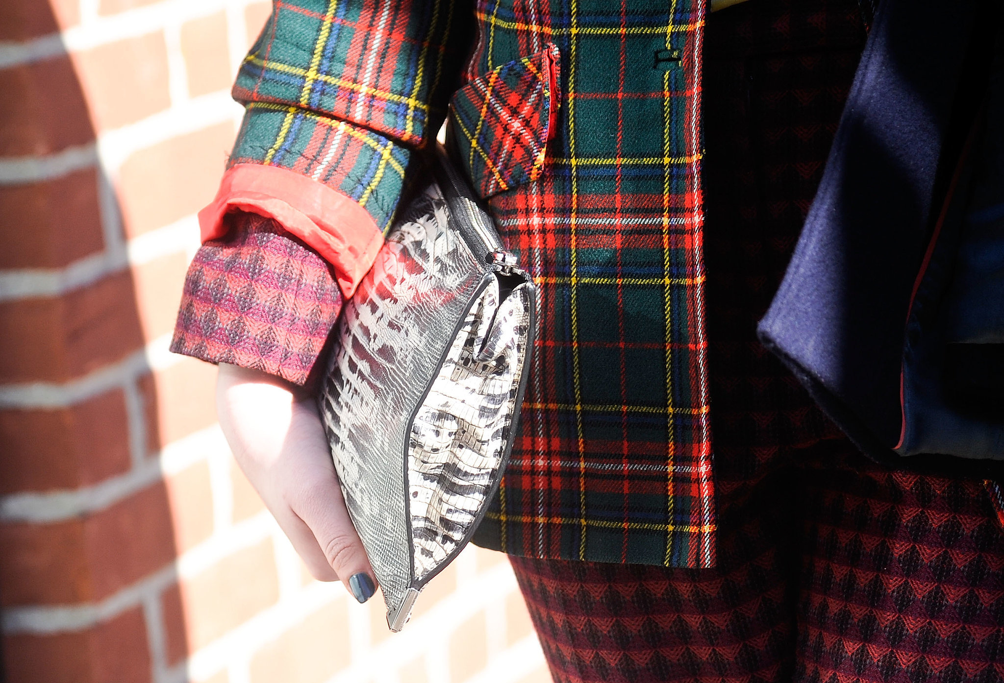 Mixing exotic, plaid, and more print for an unexpectedly cool effect. 
