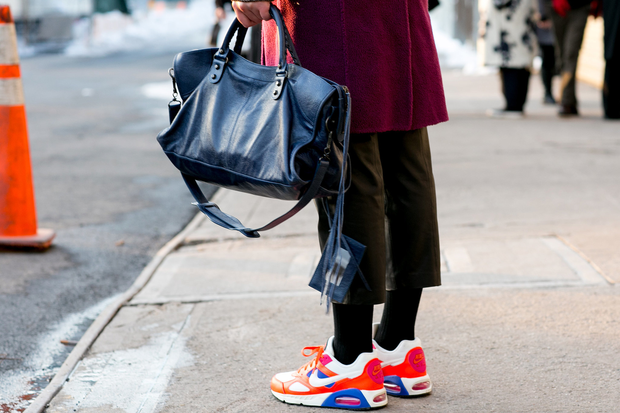 Who knew how well a Balenciaga bag went with Nikes?!
