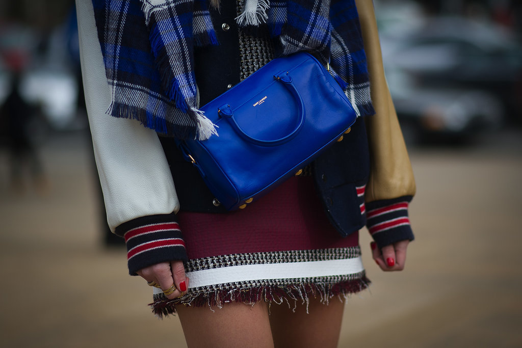 Chiara Ferragni dressed up a varsity jacket with a bright blue Saint Laurent bag.
Chiara Ferragni dressed up a varsity jacket with a bright blue Saint Laurent bag.