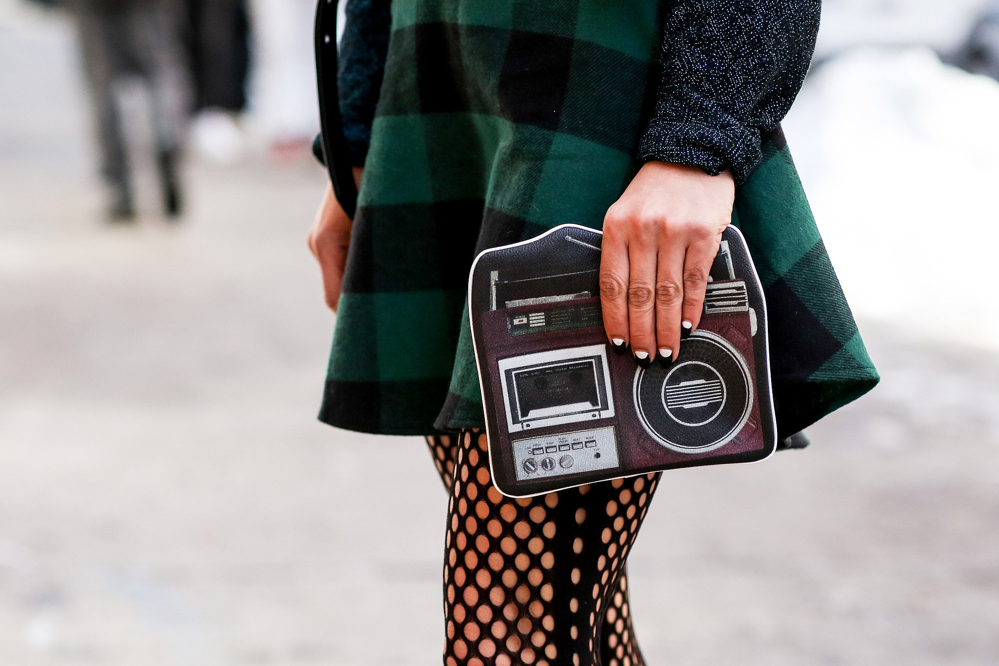 In any form, the camera is a must-have accessory at Fashion Week. 
