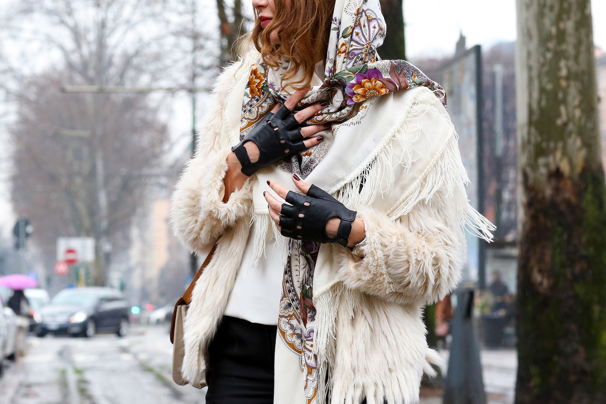 Badass biker gloves and a pretty scarf go surprisingly well together. 
