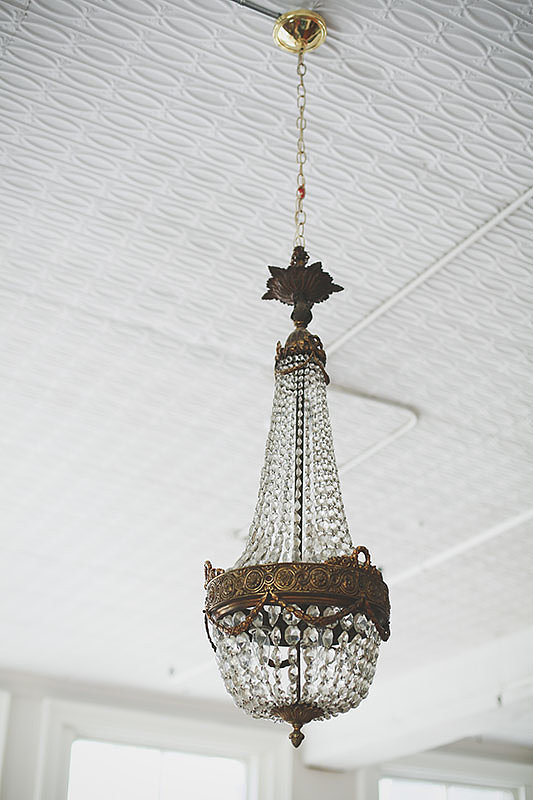 An antique chandelier adds a touch of old-world elegance.
Photo by Chellis Michael Photography
An antique chandelier adds a touch of old-world elegance.
Photo by Chellis Michael Photography