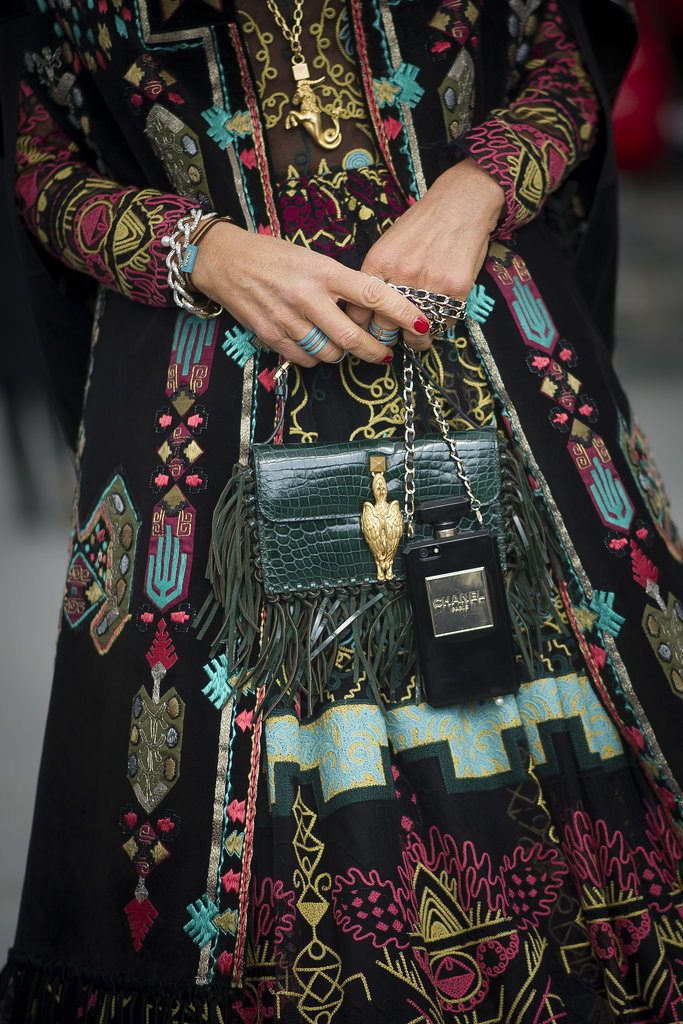 Anna Dello Russo's dark add-ons practically blend with her showstopping dress.
Anna Dello Russo's dark add-ons practically blend with her showstopping dress.