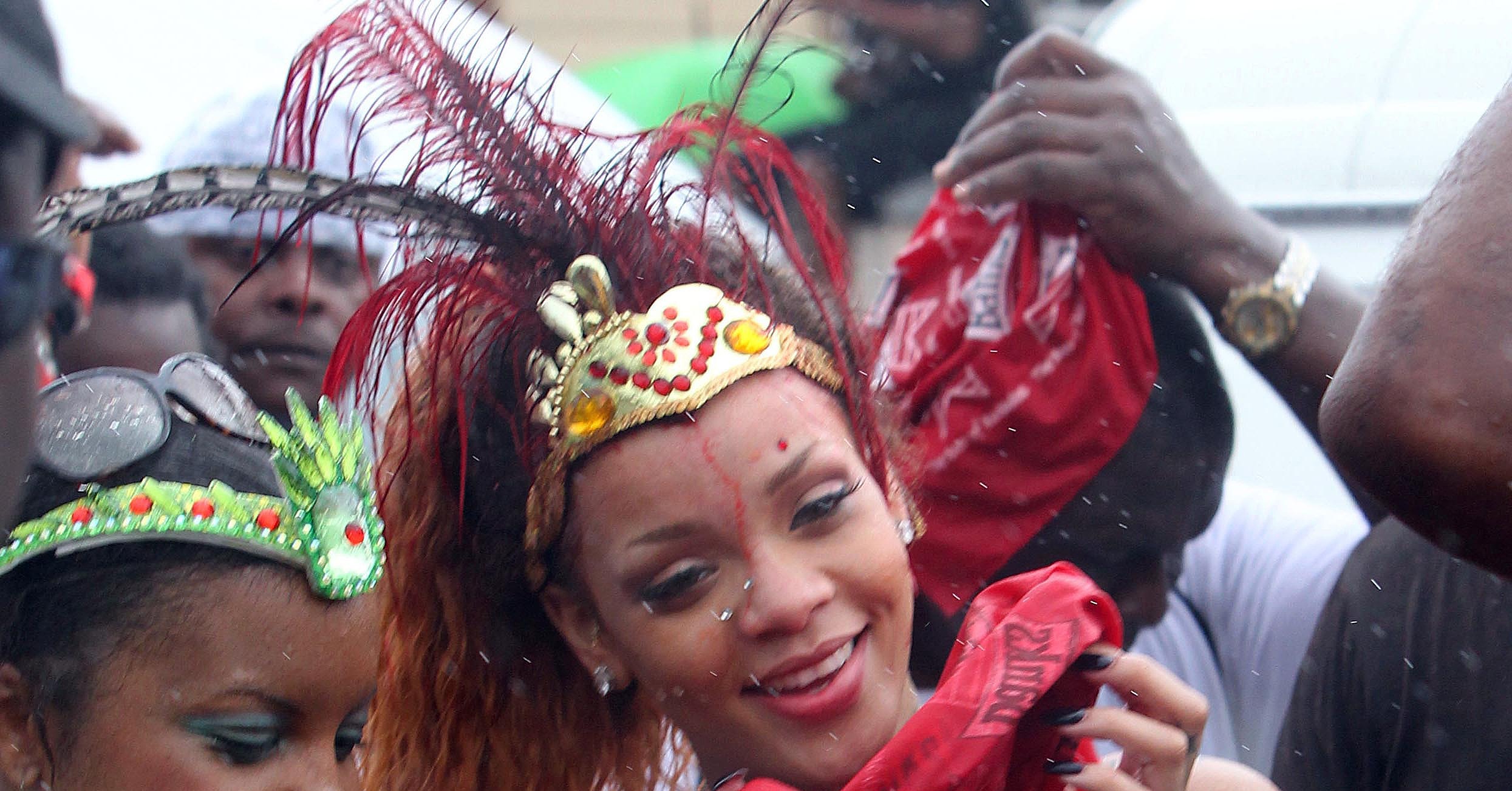 Rihanna Wore Feathers And A Bikini To A Barbados Parade Popsugar Celebrity