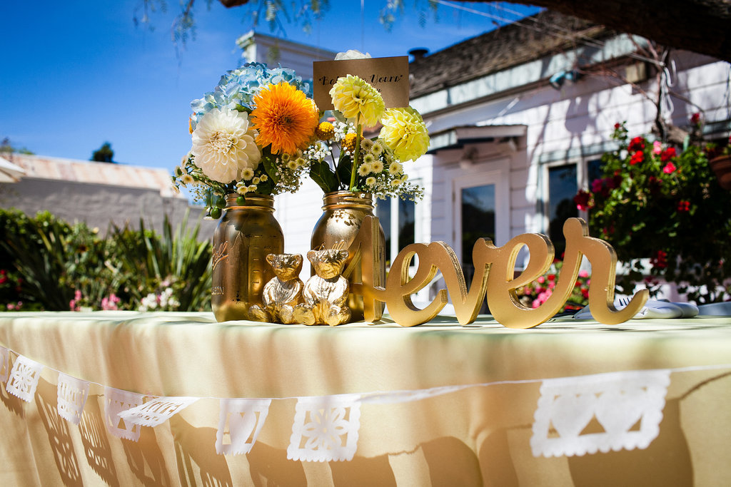 What advice would you give to other brides-to-be planning a wedding?
"You don't have to necessarily spend a lot of money on your wedding details, but you should be prepared to put in the time. It was a lot of late nights with newspaper strewn across the floor and a lot of strategic storage around our one-bedroom apartment. We also looked at a lot of OK fonts, color schemes, and decor options before settling on the right ones. Shopping is hard — don't let anybody tell you different.
And planning is extremely stressful (obviously). I can see why the honeymoon period became the honeymoon period — you're finally able to relax and remember why you like each other! My best recommendation would be to take time for yourselves outside the actual planning. Having a few nights in a row off, where you just go read somewhere and enjoy not having to worry about anything, will keep you sane . . . or as sane as possible, given the circumstances."
Photo by G Aranow Photography
What advice would you give to other brides-to-be planning a wedding?
"You don't have to necessarily spend a lot of money on your wedding details, but you should be prepared to put in the time. It was a lot of late nights with newspaper strewn across the floor and a lot of strategic storage around our one-bedroom apartment. We also looked at a lot of OK fonts, color schemes, and decor options before settling on the right ones. Shopping is hard — don't let anybody tell you different.
And planning is extremely stressful (obviously). I can see why the honeymoon period became the honeymoon period — you're finally able to relax and remember why you like each other! My best recommendation would be to take time for yourselves outside the actual planning. Having a few nights in a row off, where you just go read somewhere and enjoy not having to worry about anything, will keep you sane . . . or as sane as possible, given the circumstances."
Photo by G Aranow Photography