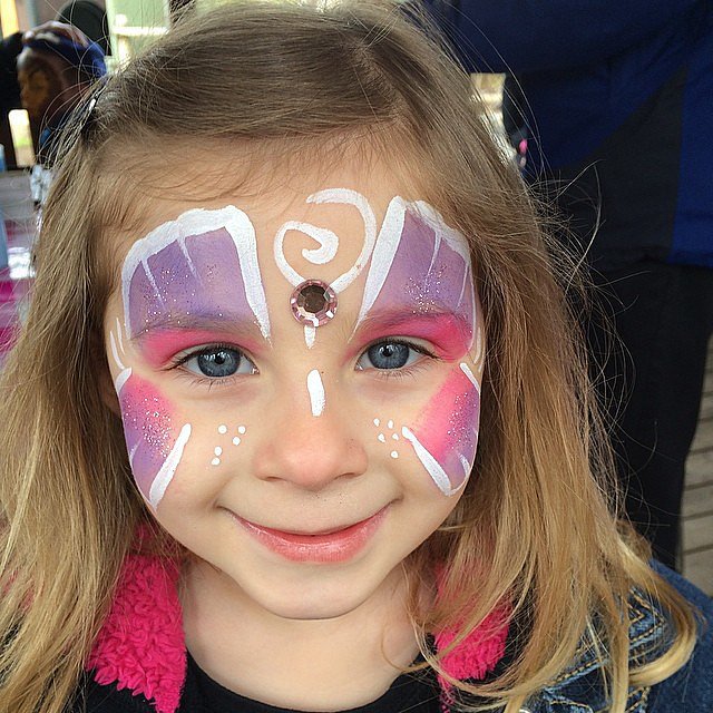 She Loves a Good Face Painting She Loves a Good Face Painting