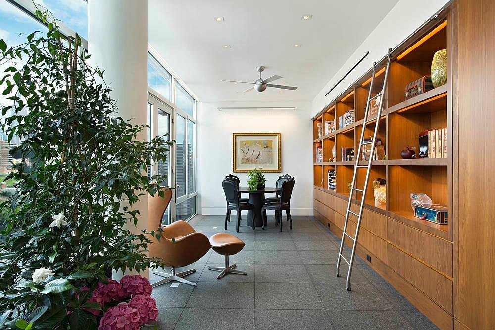 A cozy library nook complete with a ladder.
Source: Town Real Estate
