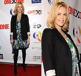 Actress Charlize Theron at the ONEXONE Foundation Gala in San Franciso Wearing a Print Dress and Black Blazer