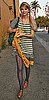 Straight-Haired Taylor Swift in LA Wearing Striped Dress, Floral Scarf, and Patterned Tights