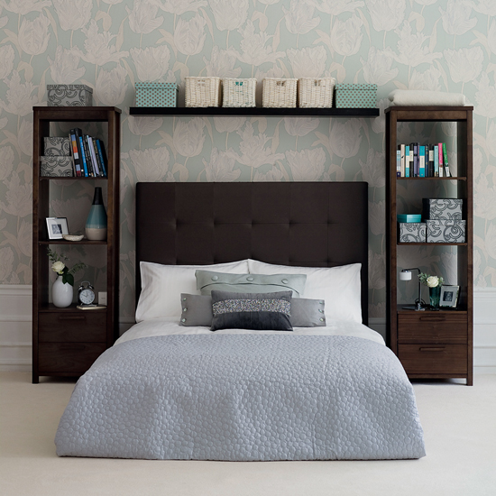 Open storage works here due to a restrained color palette and handsome storage containers. The bedside shelves also act as tables that can be used for bedside necessities such as an alarm clock and reading material.
Source
Open storage works here due to a restrained color palette and handsome storage containers. The bedside shelves also act as tables that can be used for bedside necessities such as an alarm clock and reading material.
Source