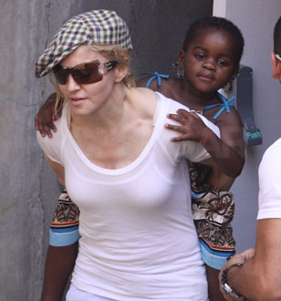 Photos of Madonna Giving Mercy a Piggyback Ride Photos of Madonna Giving Mercy a Piggyback Ride