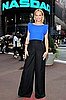 Amber Valletta Rings NASDAQ Bell in Cobalt Top and Wide-Leg Black Pants