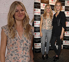 Photo of Sienna Miller in Gray Jeans and Printed Top at 2010 London Fashion Week