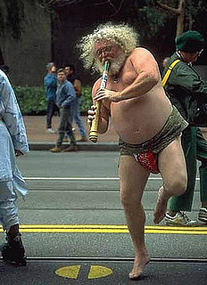 Man Playing Flute in Street