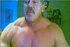 Muscle Man Admires Himself for the Camera