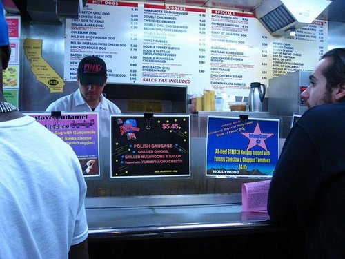 This is the main counter. You don't order here, you sort of sidle along and watch them make the people in front of you's orders. Note the menu in the back. I sort of wished I ordered the Pastrami Burrito Dog. Okay maybe more than "sort of."
This is the main counter. You don't order here, you sort of sidle along and watch them make the people in front of you's orders. Note the menu in the back. I sort of wished I ordered the Pastrami Burrito Dog. Okay maybe more than "sort of."