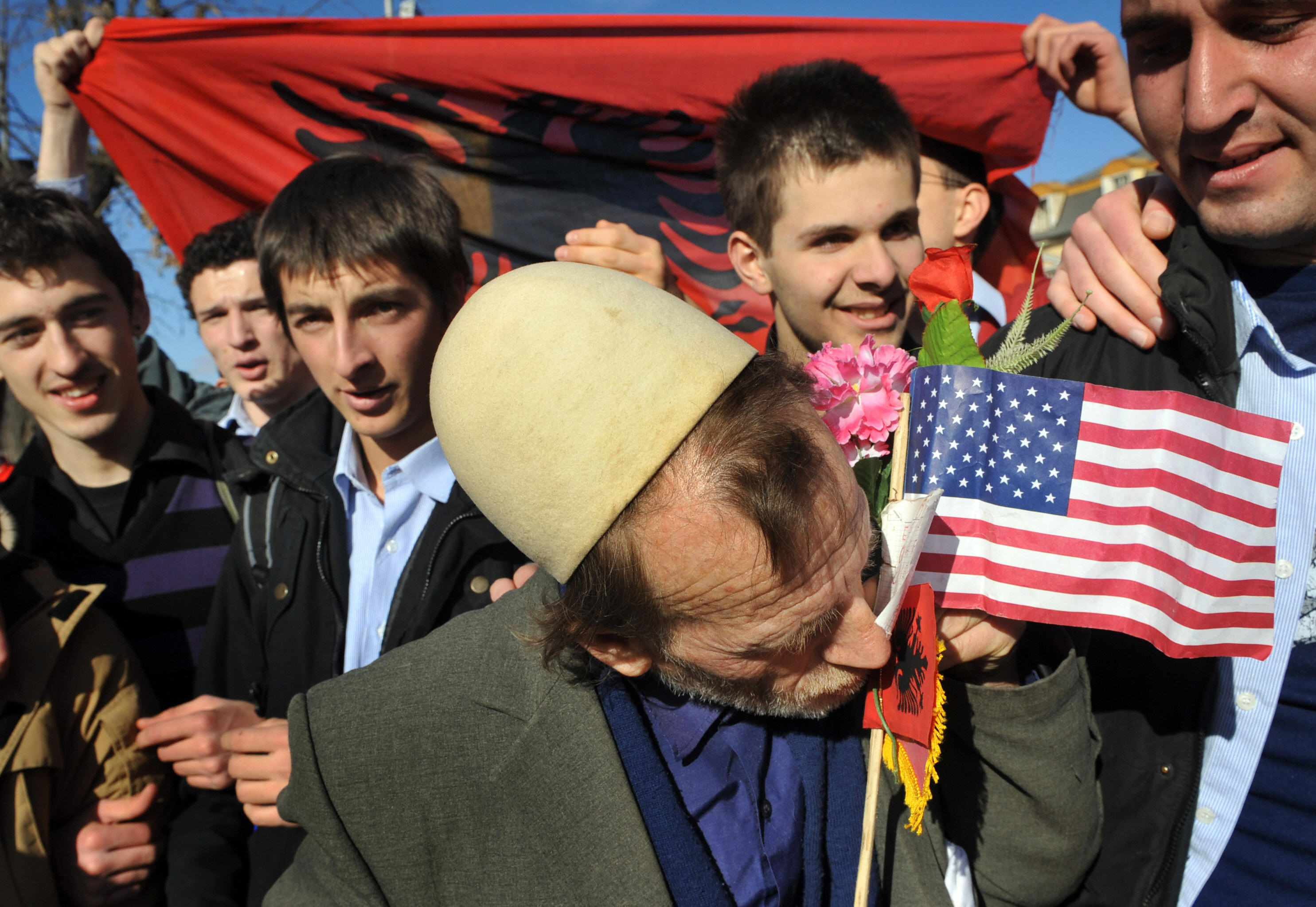 A Kosovan kisses the Albanian and US flags, as people gathered to celebrate in downtown Pristina on February 19, 2008. A Kosovan kisses the Albanian and US flags, as people gathered to celebrate in downtown Pristina on February 19, 2008.