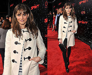 Amanda Peet Attends "The Spirit" Los Angeles Premiere in an Ivory Toggle Coat