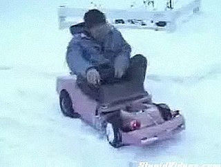 Guy Does Donuts in the Snow With Malibu Barbie Car
