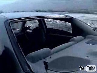 Two People With a Bowling Ball Blow Out Car Window