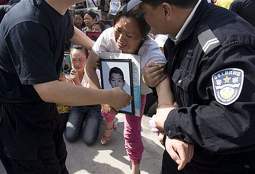 Chinese Police Drag Grieving Parents From Protest
