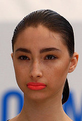 How To Catwalk Runway Bright Coral Lipstick Bold Brow Trend. Spring 2009. London Fashion Week: Osman Yousefzada Show