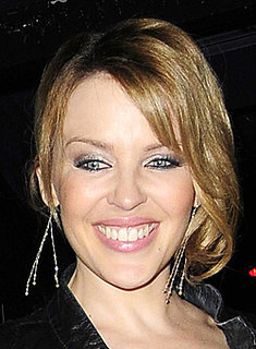 Photo of Kylie Minogue Latest Hair and Makeup Look. Smoky Eyes and Dark Roots. Love or Hate Her Beauty Style?